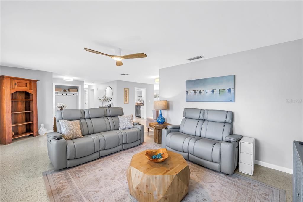 14546 Anchorage Circle Seminole, FL 33776 - Photo 13 of 88 a living room with furniture and a rug