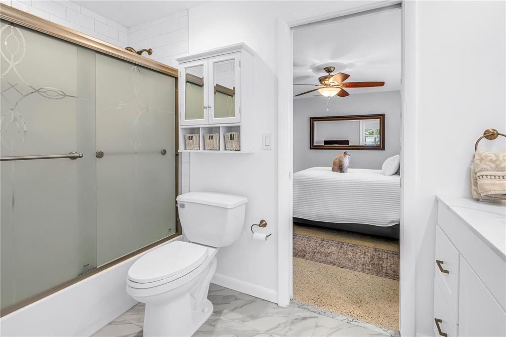 14546 Anchorage Circle Seminole, FL 33776 - Photo 22 of 88 a bathroom with a toilet a sink and a mirror