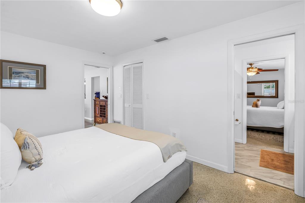 14546 Anchorage Circle Seminole, FL 33776 - Photo 23 of 88 a bedroom with a bed and a couch