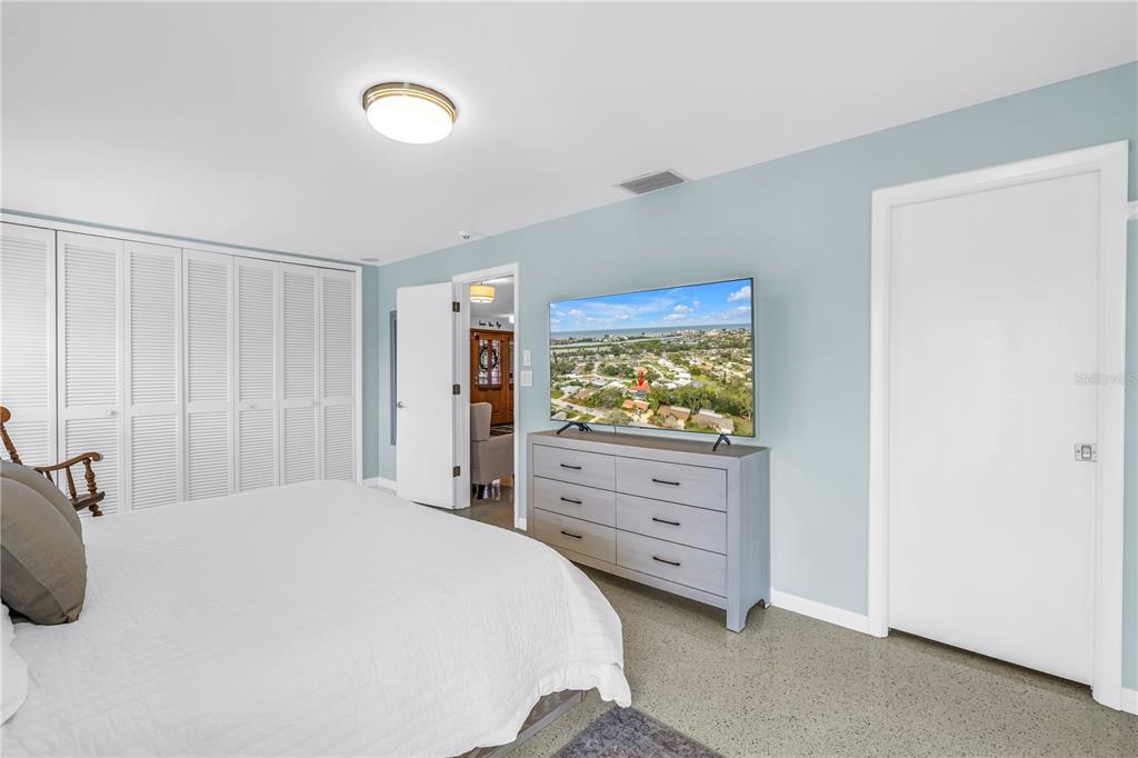 14546 Anchorage Circle Seminole, FL 33776 - Photo 36 of 88 a bedroom with a bed and a dresser