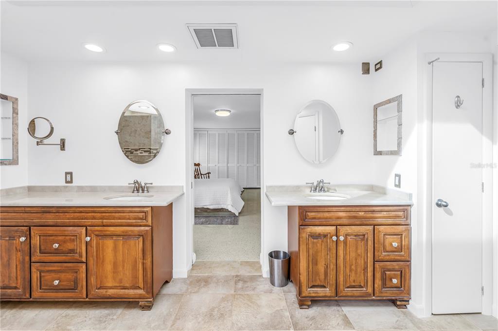 14546 Anchorage Circle Seminole, FL 33776 - Photo 39 of 88 a living room with a sink and a mirror