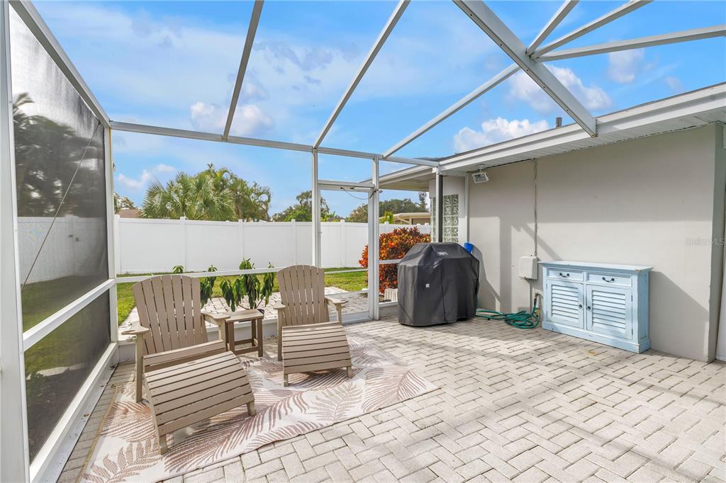 14546 Anchorage Circle Seminole, FL 33776 - Photo 51 of 88 a view of a patio with table and chairs