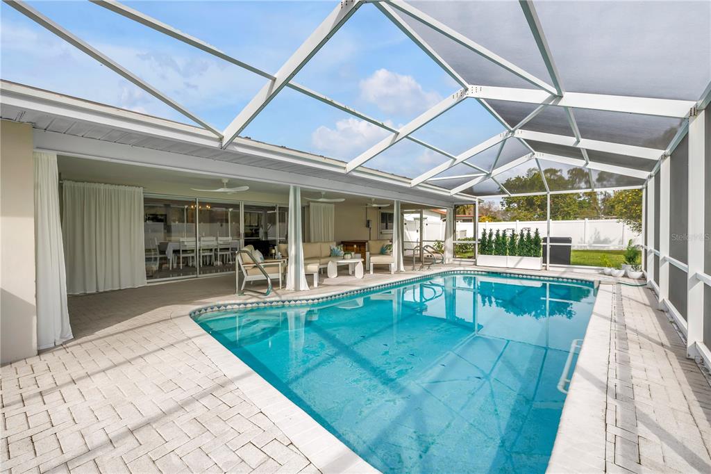 14546 Anchorage Circle Seminole, FL 33776 - Photo 52 of 88 a view of swimming pool with seating area