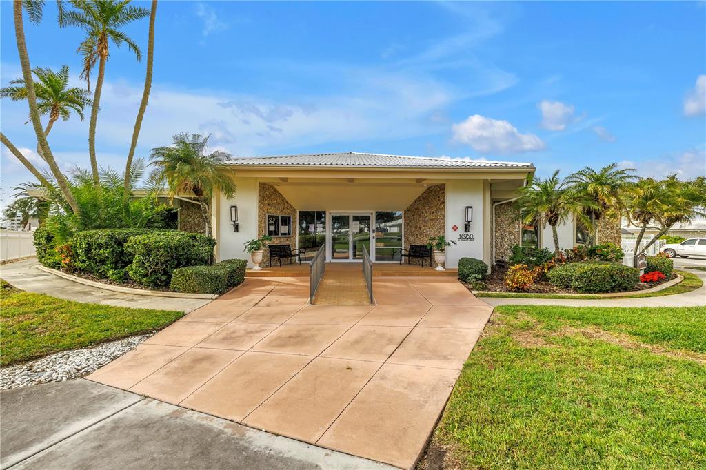 14546 Anchorage Circle Seminole, FL 33776 - Photo 63 of 88 a view of a house with backyard porch and sitting area
