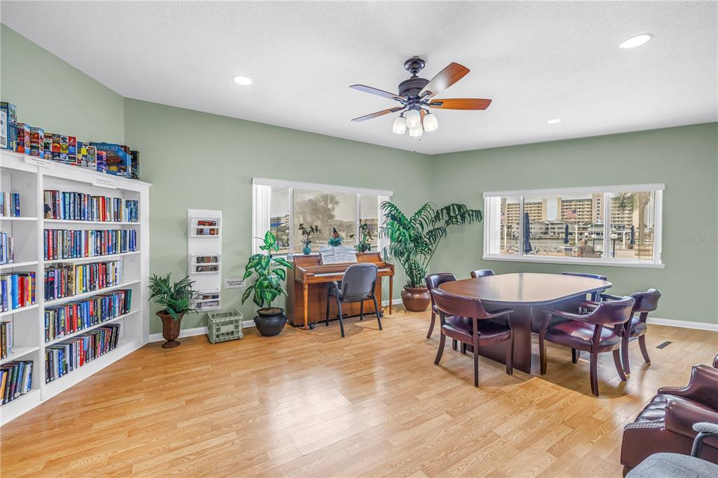 14546 Anchorage Circle Seminole, FL 33776 - Photo 67 of 88 a view of a livingroom with furniture and a bookshelf