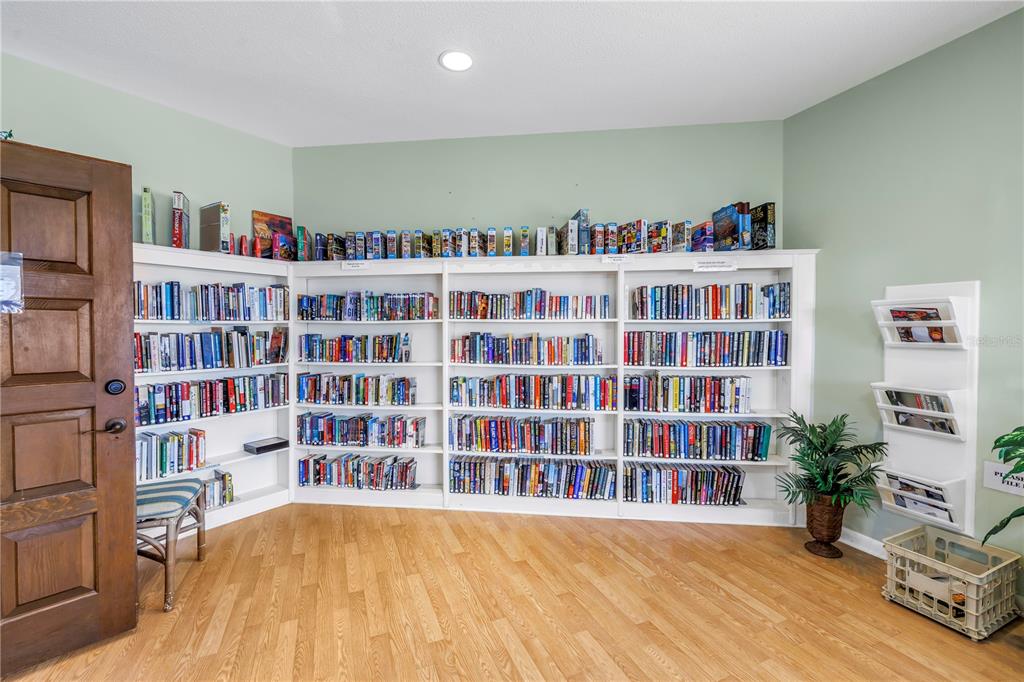 14546 Anchorage Circle Seminole, FL 33776 - Photo 68 of 88 a view of a living room with furniture and book shelf