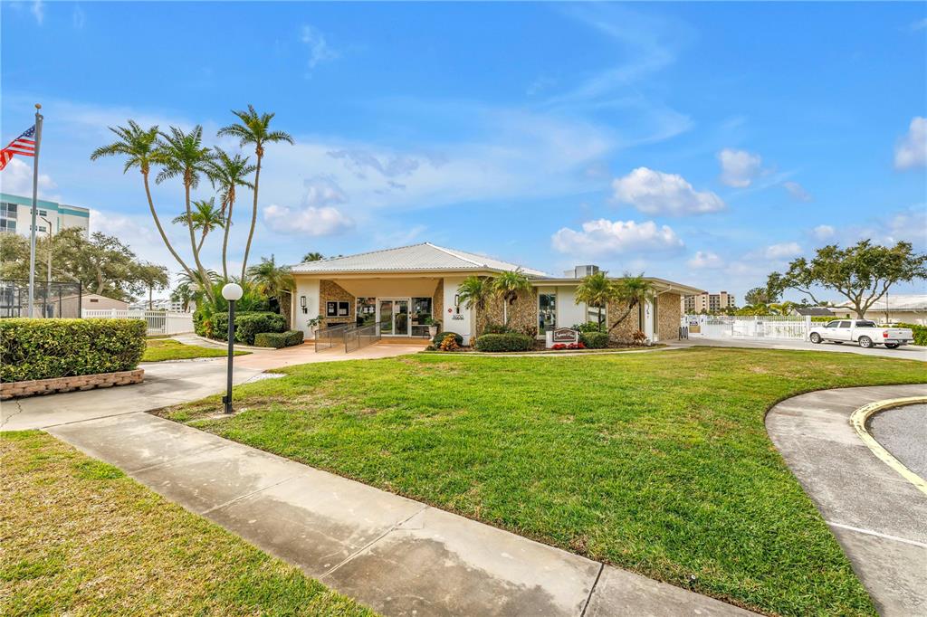 14546 Anchorage Circle Seminole, FL 33776 - Photo 86 of 88 a front view of house with yard and outdoor seating
