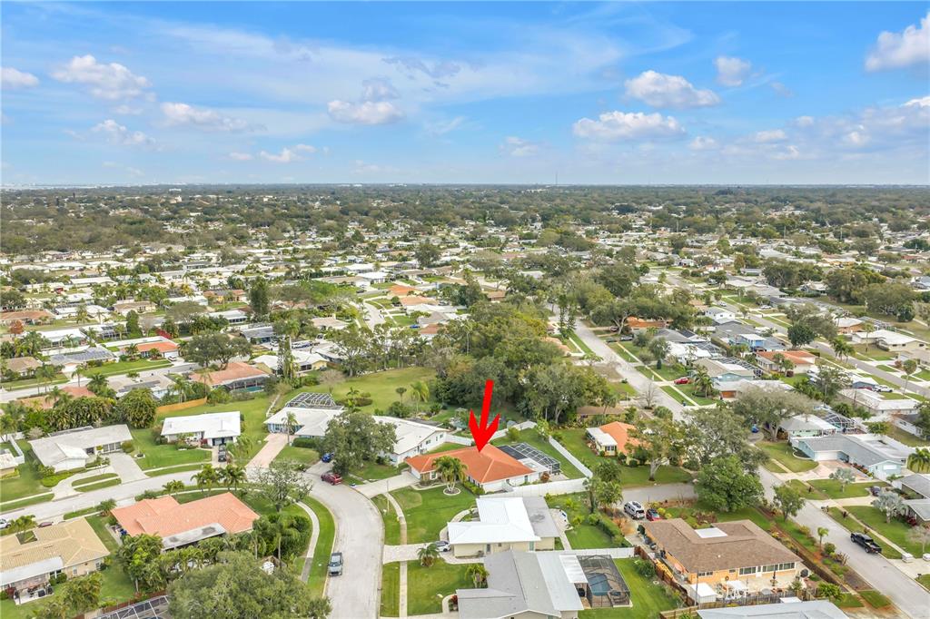 14546 Anchorage Circle Seminole, FL 33776 - Photo 88 of 88 an aerial view of residential building with an outdoor space and seating