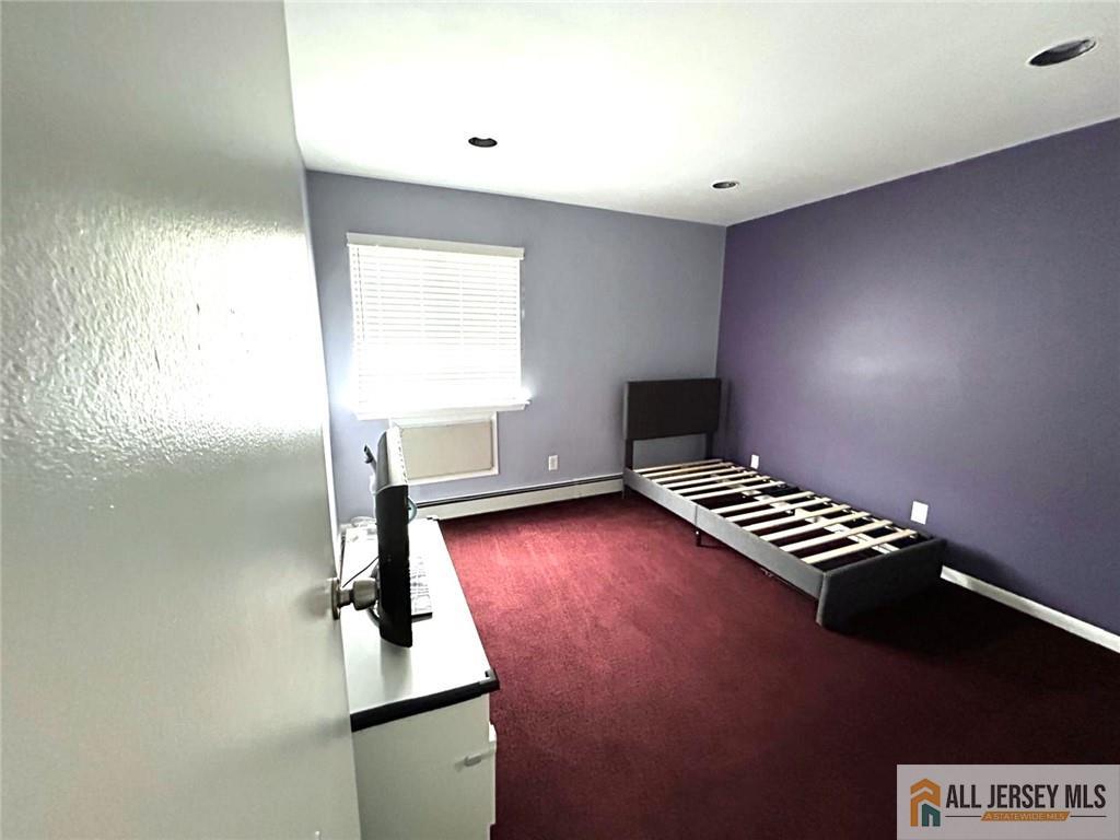 532 Cricket Lane, Unit 532 Woodbridge, NJ 07095 - Photo 12 of 14 a view of an empty room with windows