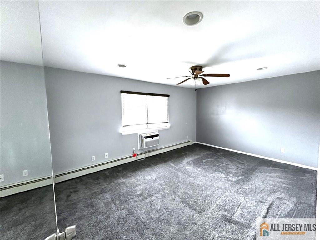 532 Cricket Lane, Unit 532 Woodbridge, NJ 07095 - Photo 13 of 14 an empty room with a window