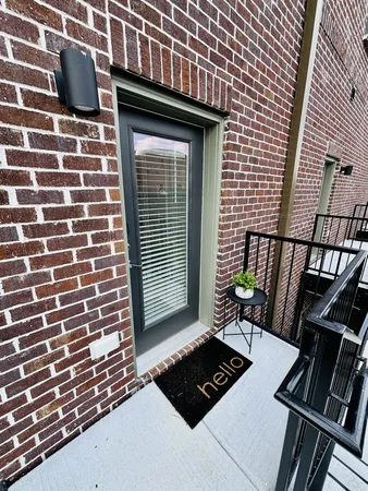 a view of a backyard with sitting area