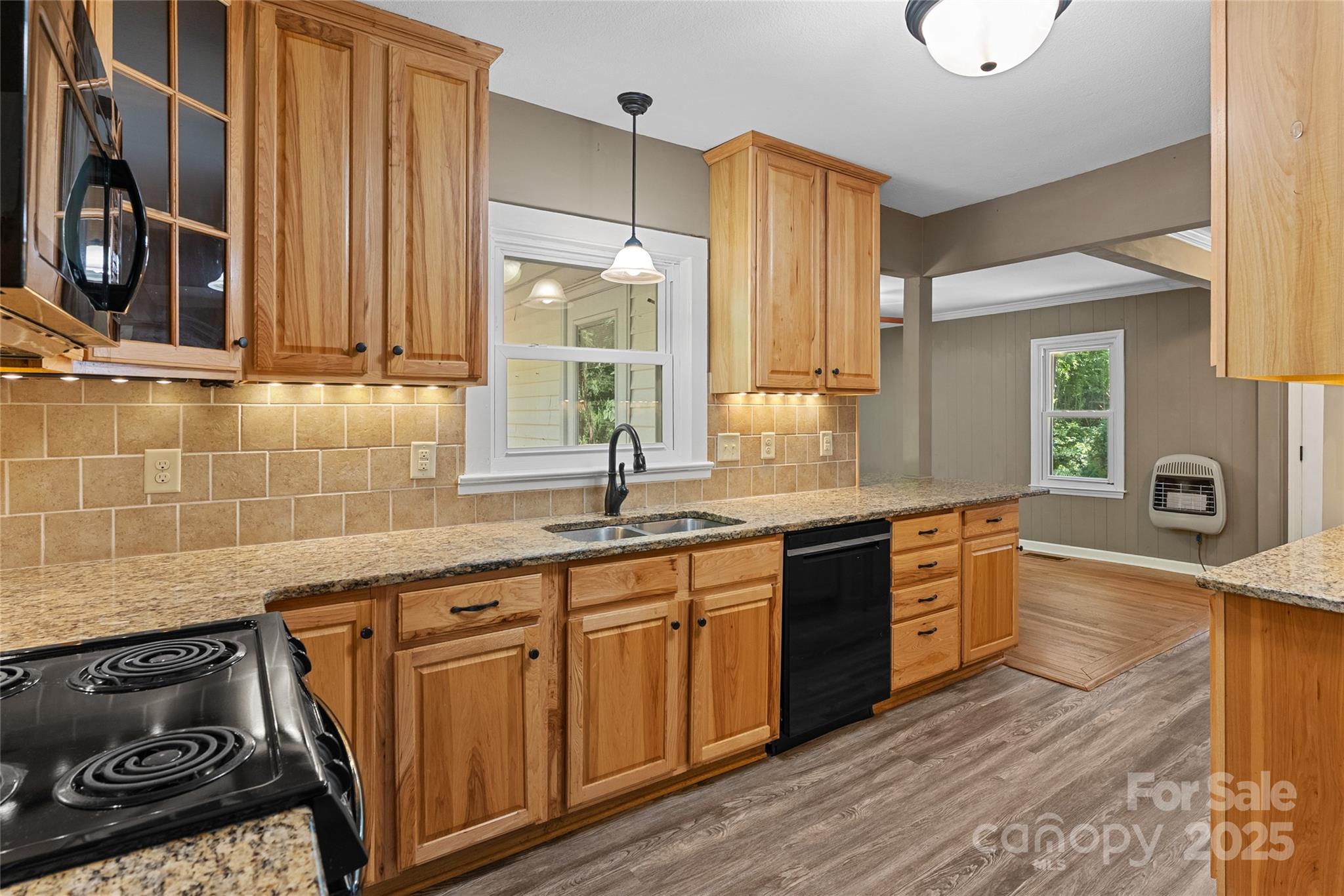 80 Laurel Avenue Tryon, NC 28782 - Photo 11 of 43 a large kitchen with granite countertop a stove and a sink