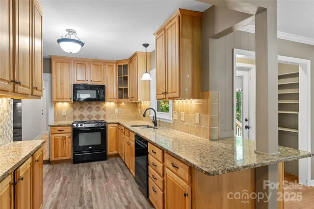 a view of a dining room with furniture and a livingroom