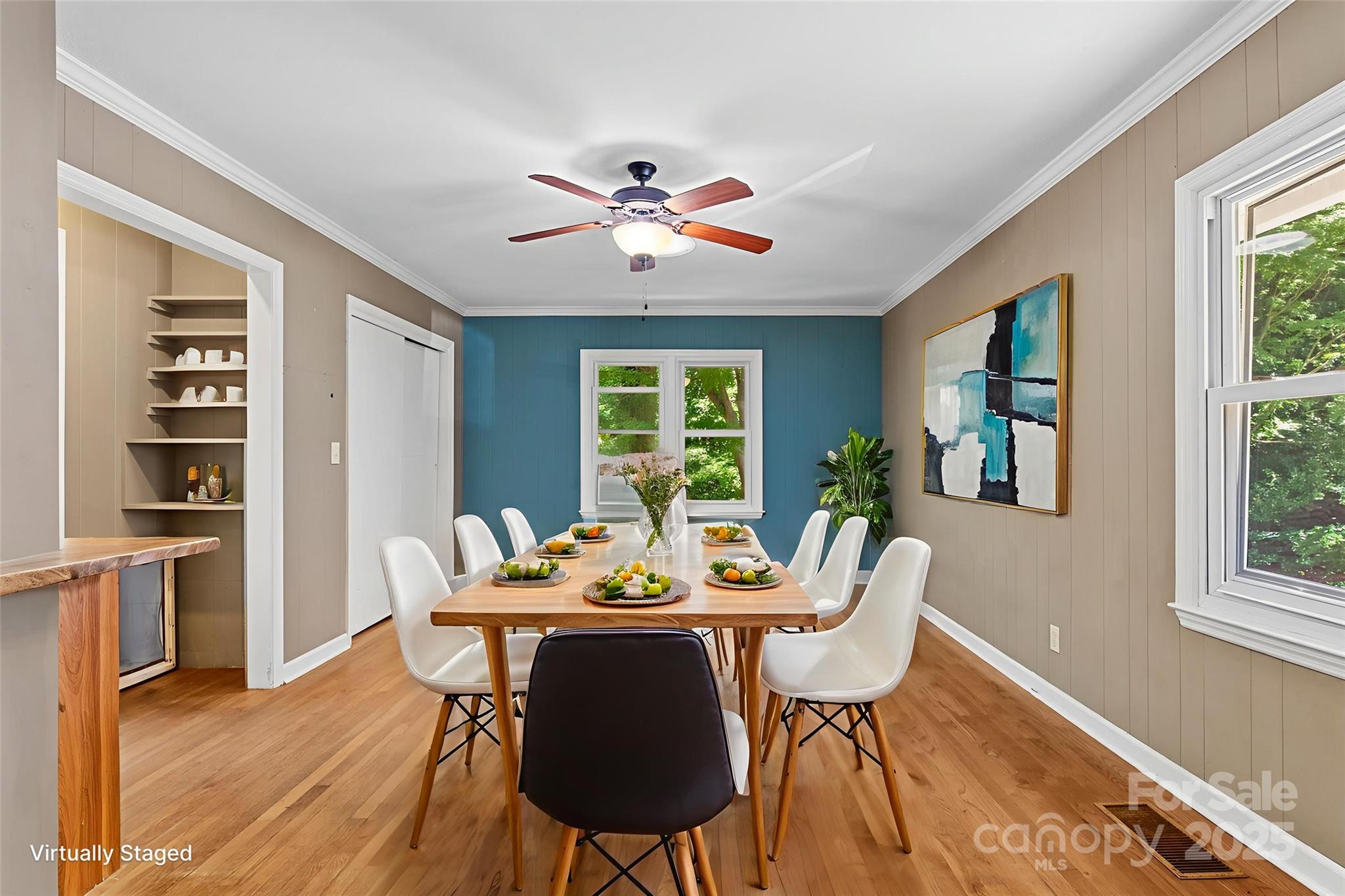 80 Laurel Avenue Tryon, NC 28782 - Photo 15 of 43 a dining room with furniture a window and wooden floor
