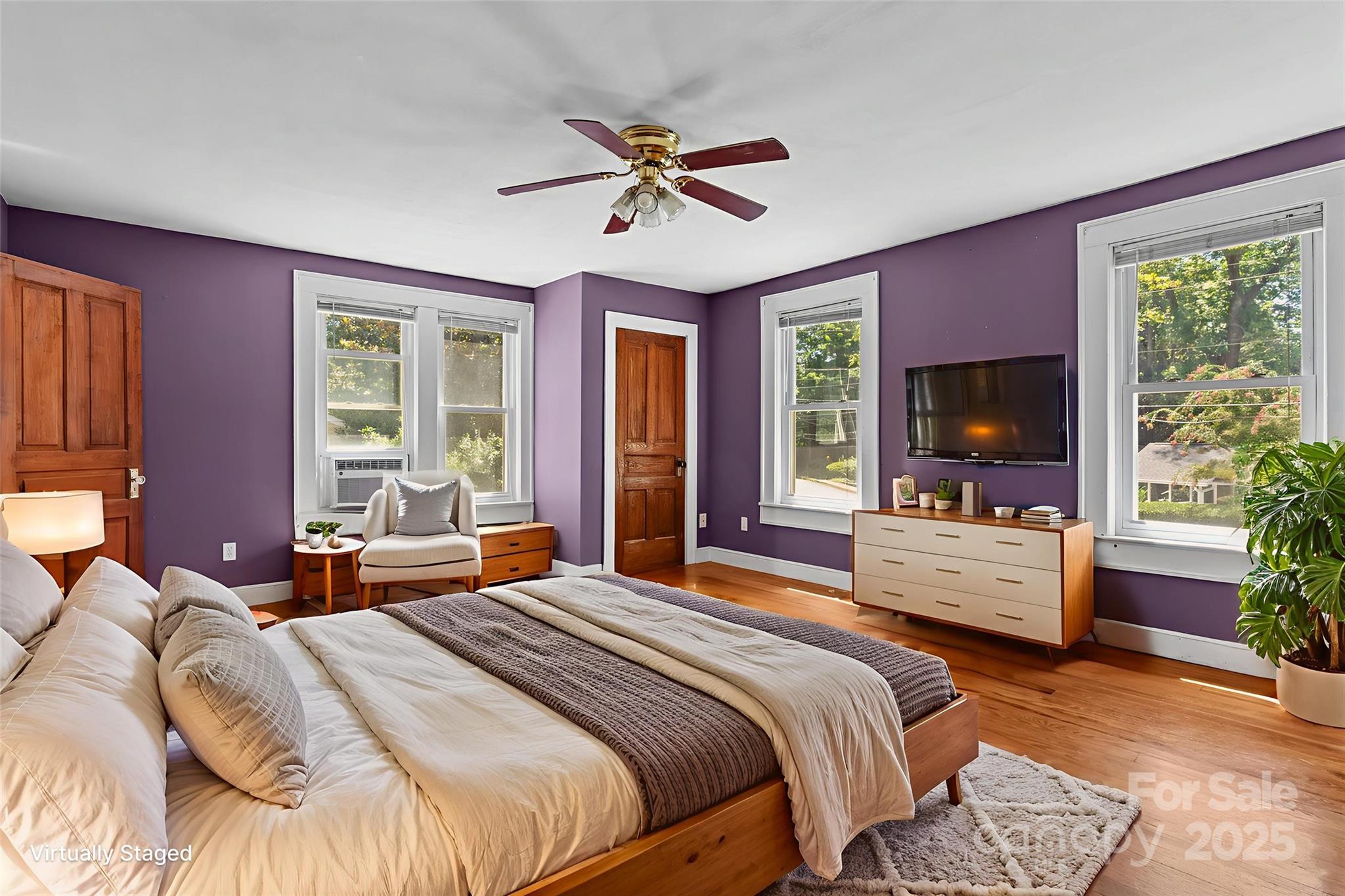 80 Laurel Avenue Tryon, NC 28782 - Photo 21 of 43 a bedroom with a bed and a large window