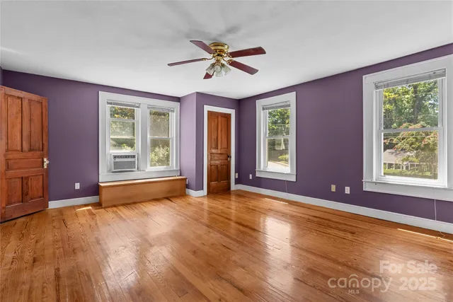a view of livingroom with window ceiling fan and hardwood floor