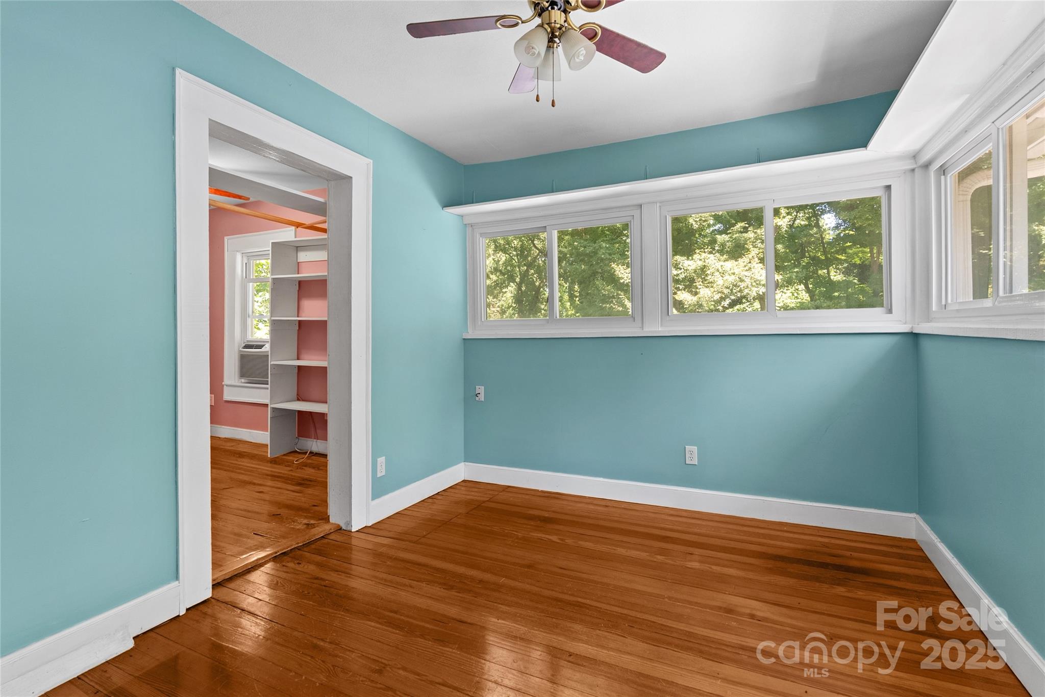 80 Laurel Avenue Tryon, NC 28782 - Photo 30 of 43 a view of empty room with wooden floor and fan