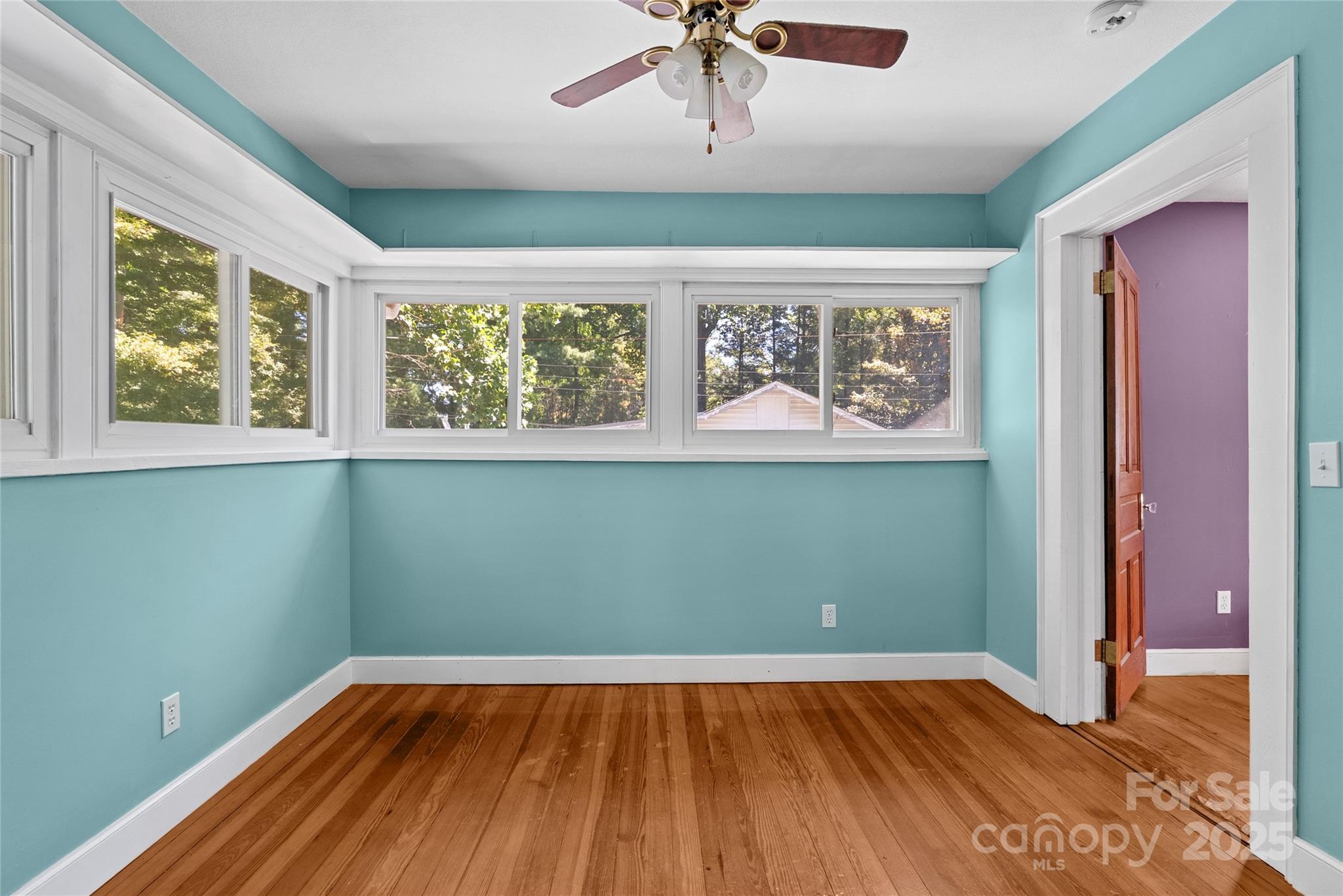 80 Laurel Avenue Tryon, NC 28782 - Photo 32 of 43 a view of room with window and wooden floor