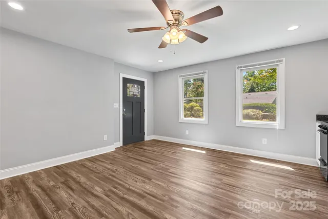 a kitchen with stainless steel appliances granite countertop a stove and a refrigerator