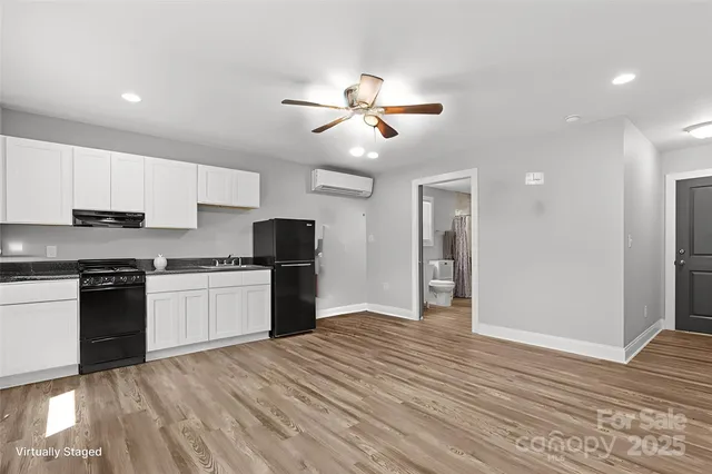 a kitchen with a dining table and chairs