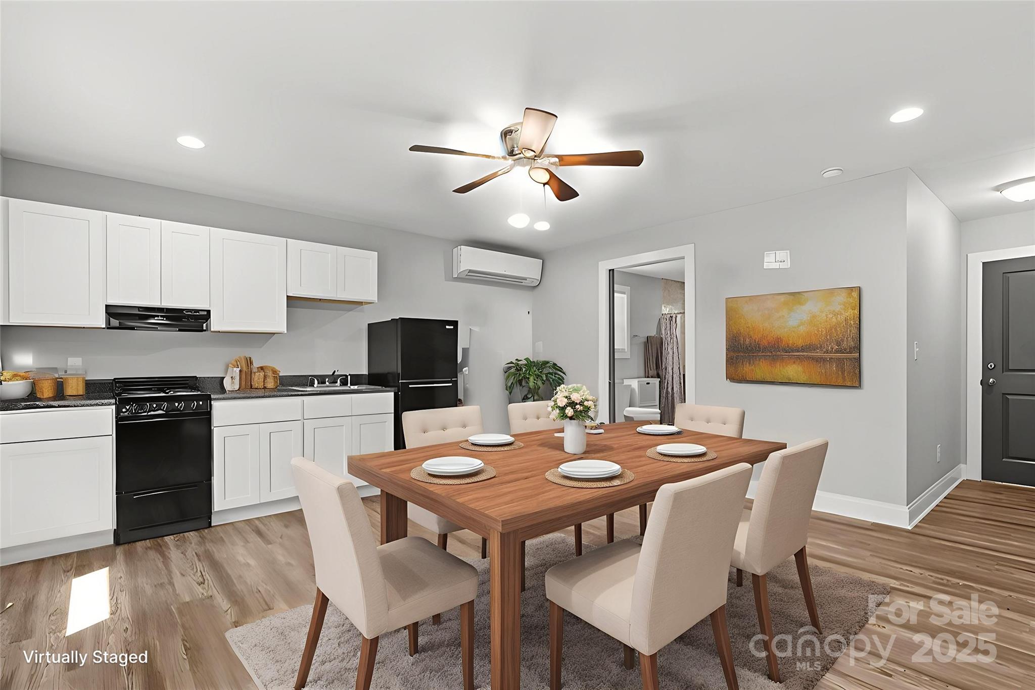 80 Laurel Avenue Tryon, NC 28782 - Photo 37 of 43 a kitchen with a dining table and chairs