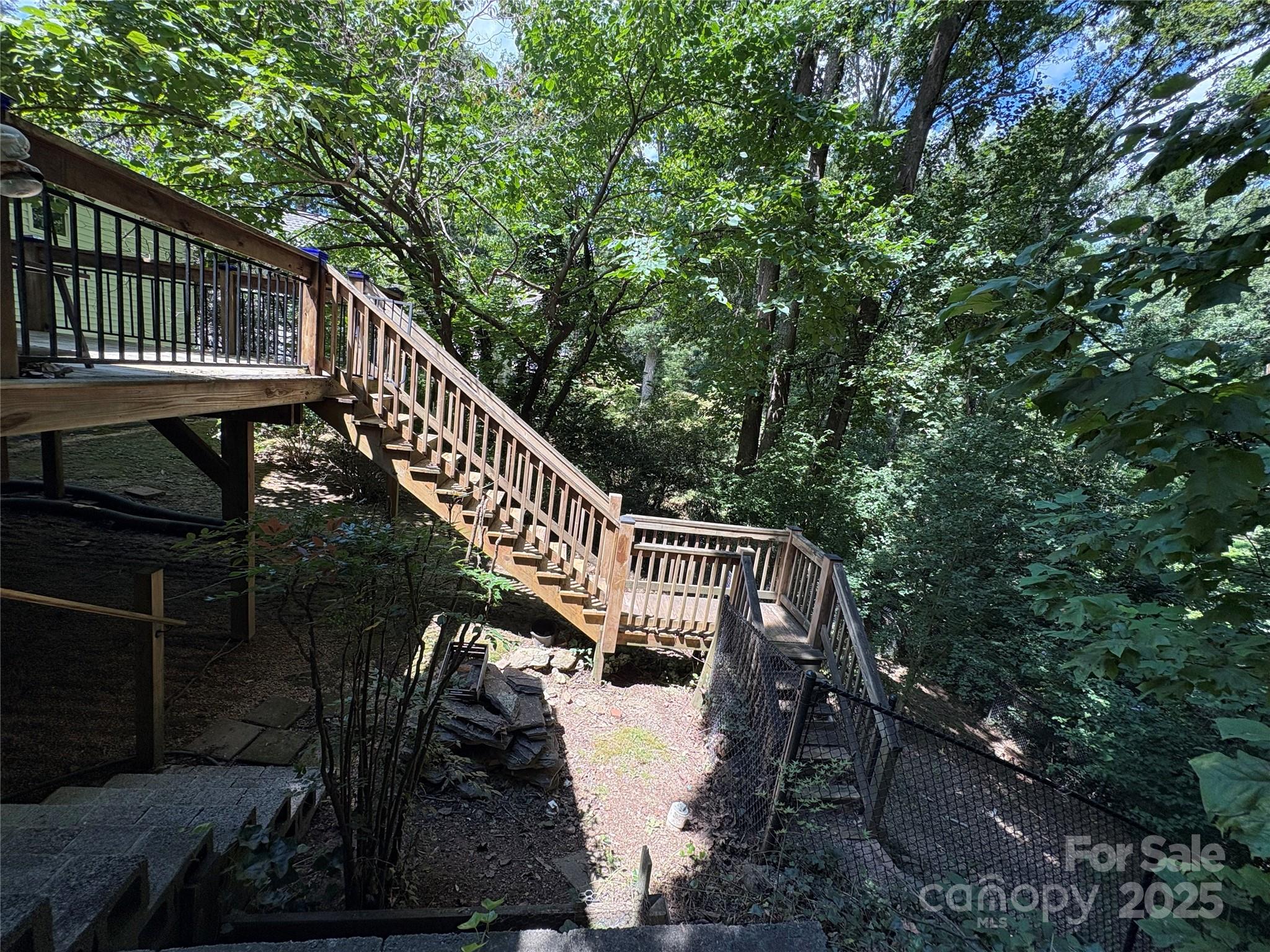 80 Laurel Avenue Tryon, NC 28782 - Photo 42 of 43 a balcony with wooden floor and trees