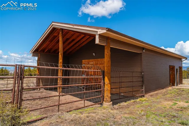 a view of wooden house with a large window