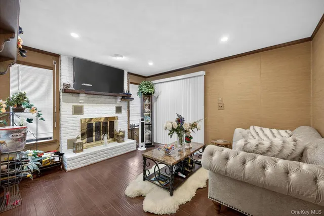 a living room with furniture potted plant and a fireplace