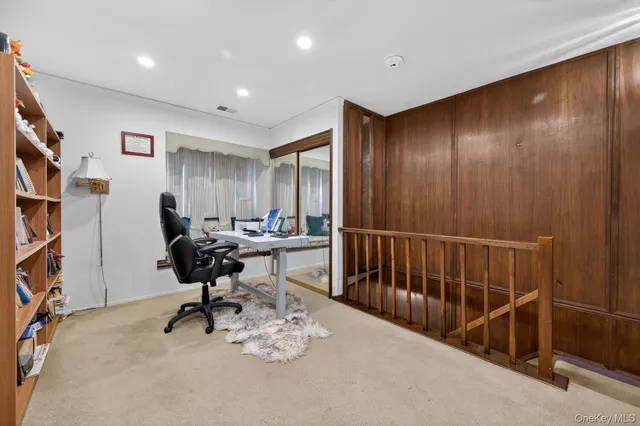 a view of a livingroom with workspace and a couch