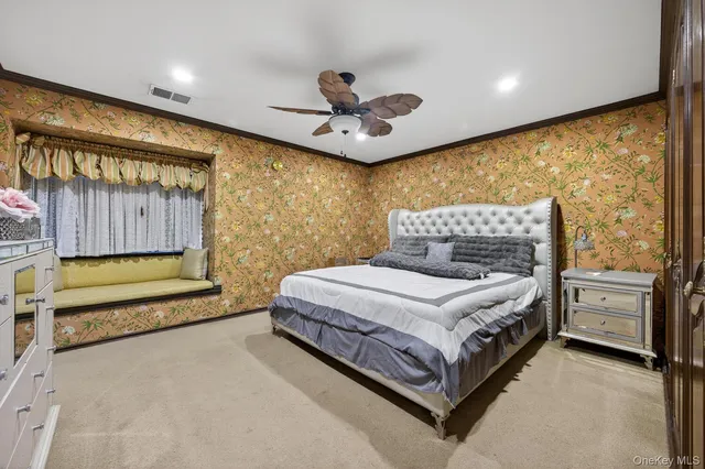 a spacious bedroom with a bed and window