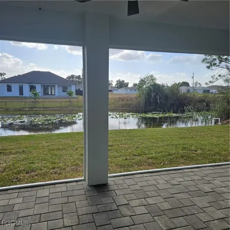 a view of a field with an ocean view