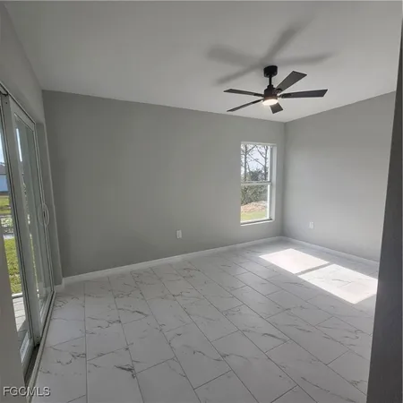 a view of an empty room and window