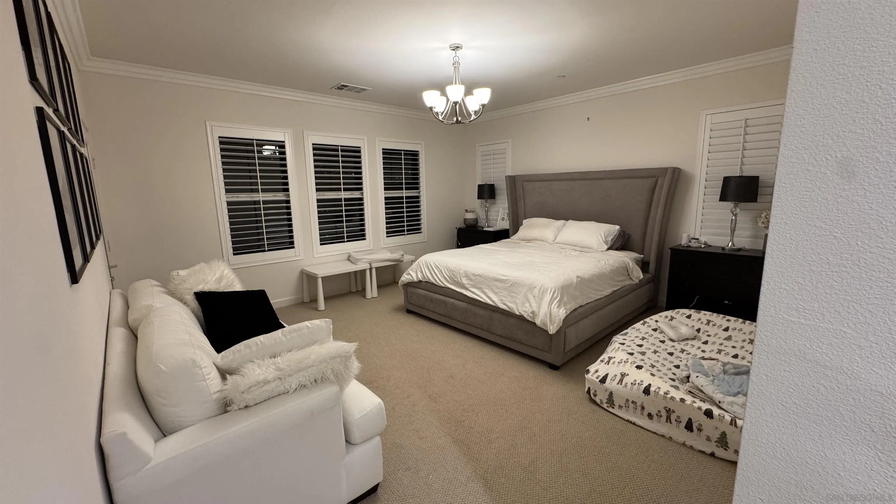 1337 Baumgartner Way Escondido, CA 92026 - Photo 17 of 20 a bedroom with bed couch and window