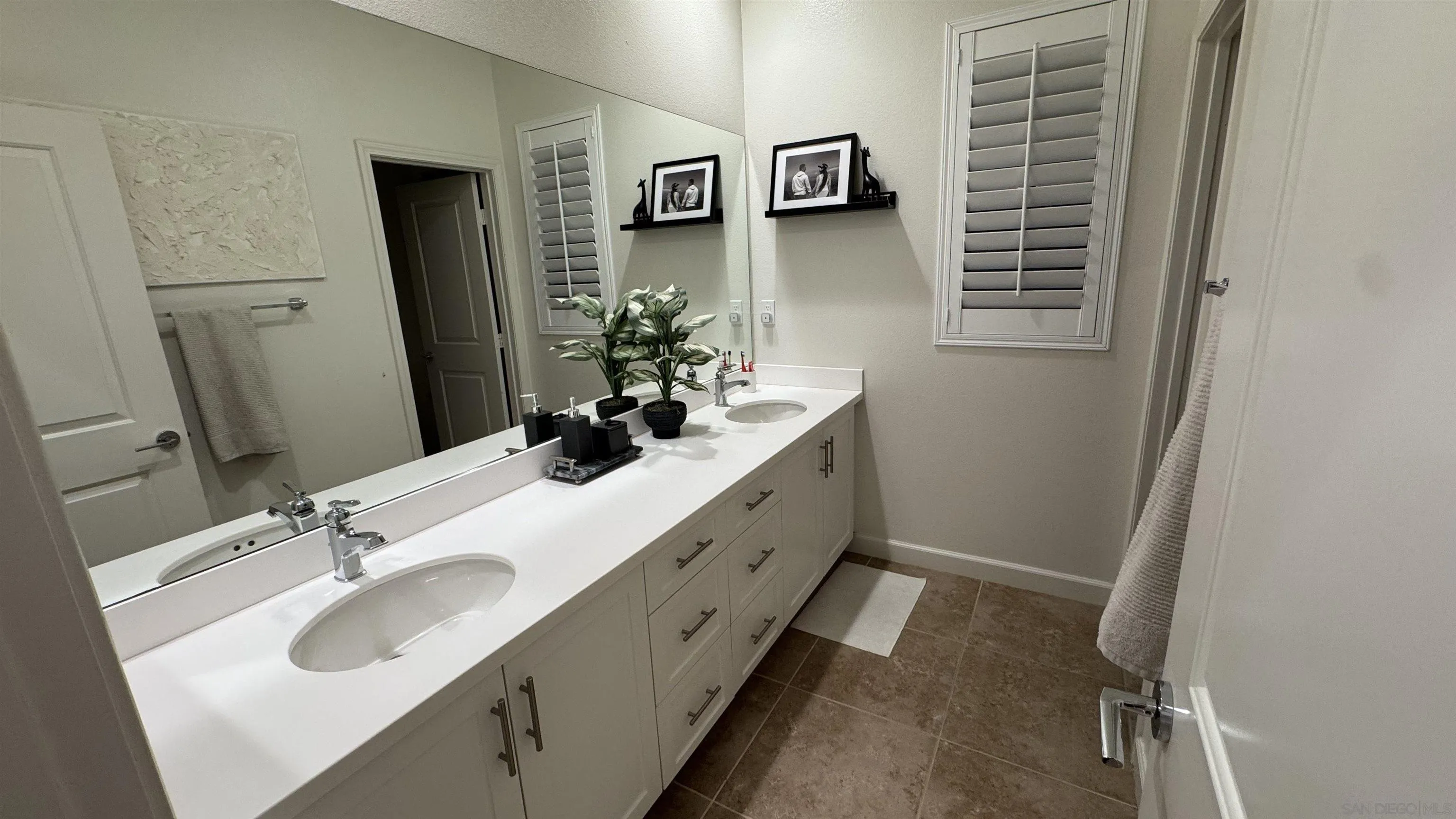 1337 Baumgartner Way Escondido, CA 92026 - Photo 18 of 20 a bathroom with a sink and a mirror