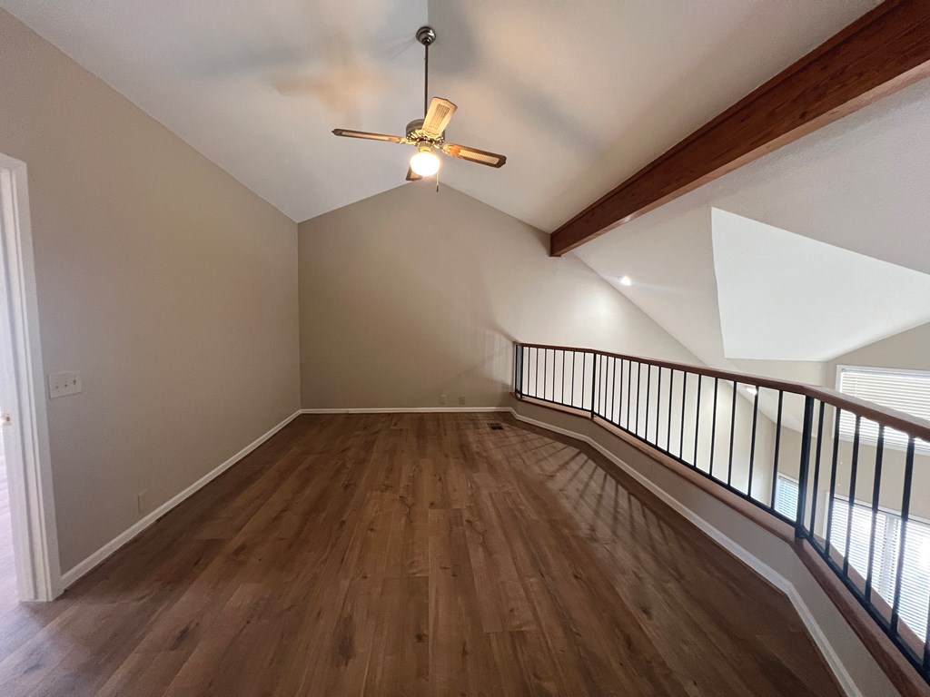805-139 Highway 534 Loop Kerrville, TX 78028 - Photo 14 of 28 a view of a hallway with wooden floor and chandelier