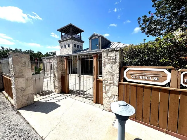 a front view of a building with parking space