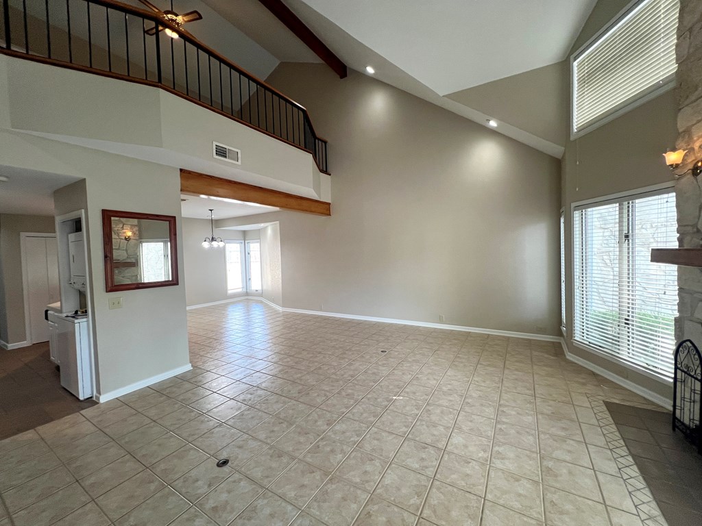 805-139 Highway 534 Loop Kerrville, TX 78028 - Photo 4 of 28 a view of a hallway with wooden floor and staircase