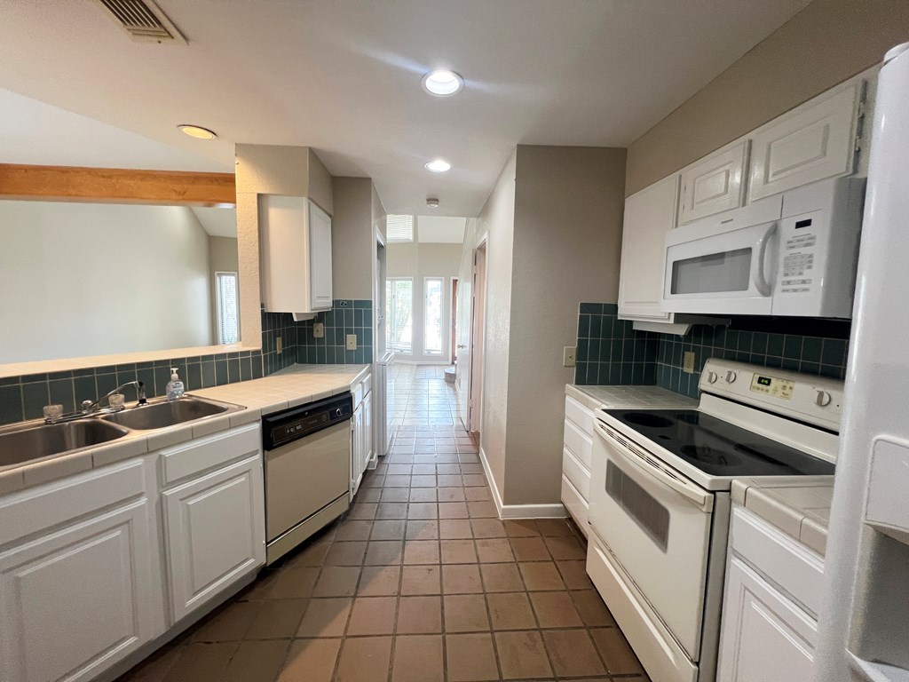 805-139 Highway 534 Loop Kerrville, TX 78028 - Photo 9 of 28 a kitchen with a sink stove and cabinets