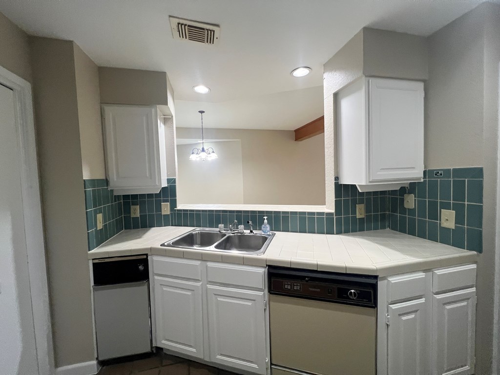 805-139 Highway 534 Loop Kerrville, TX 78028 - Photo 10 of 28 a kitchen with a sink and cabinets