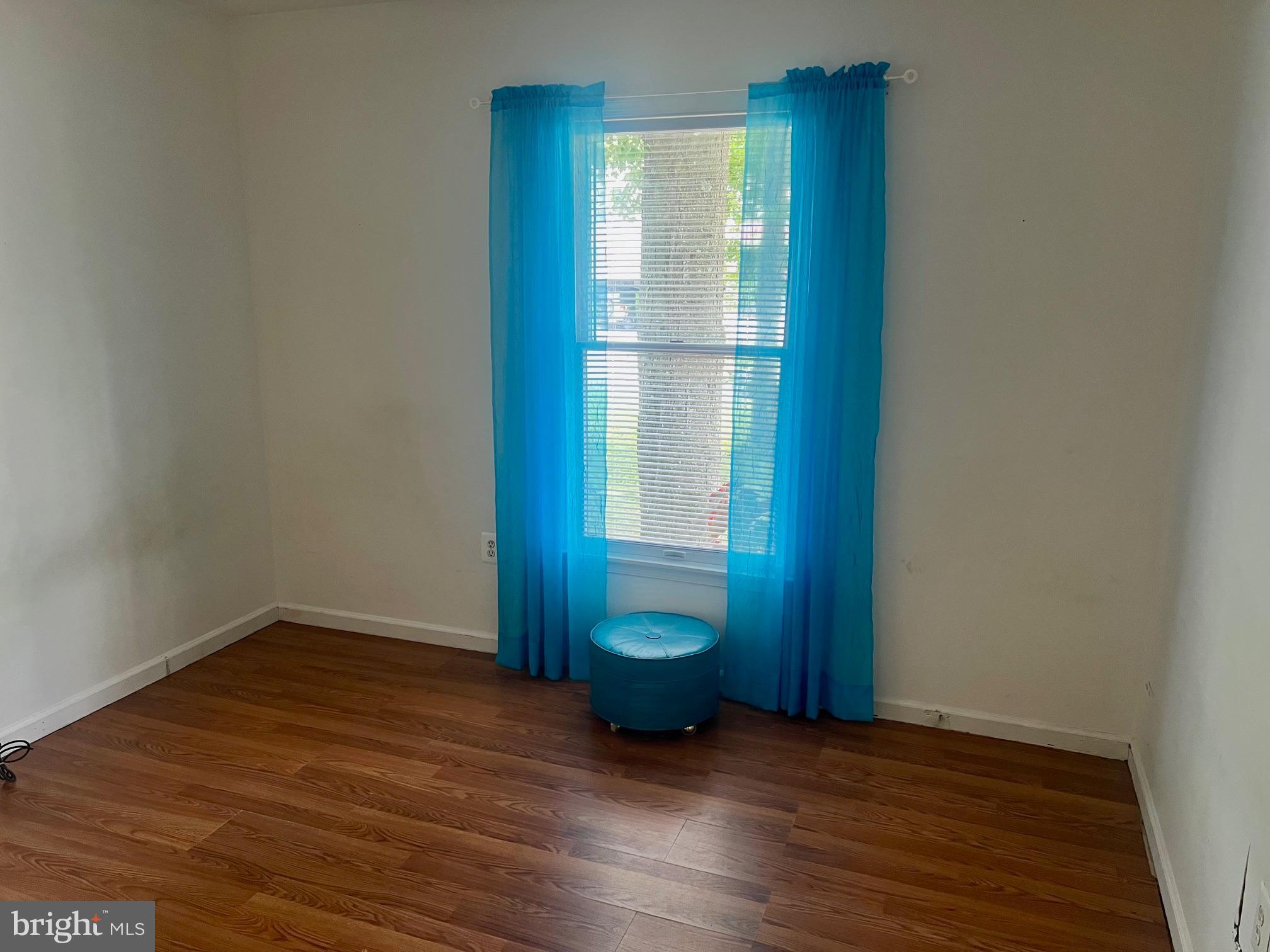 60 Nottingham Lane Berlin, MD 21811 - Photo 11 of 38 a view of an empty room with wooden floor and a window