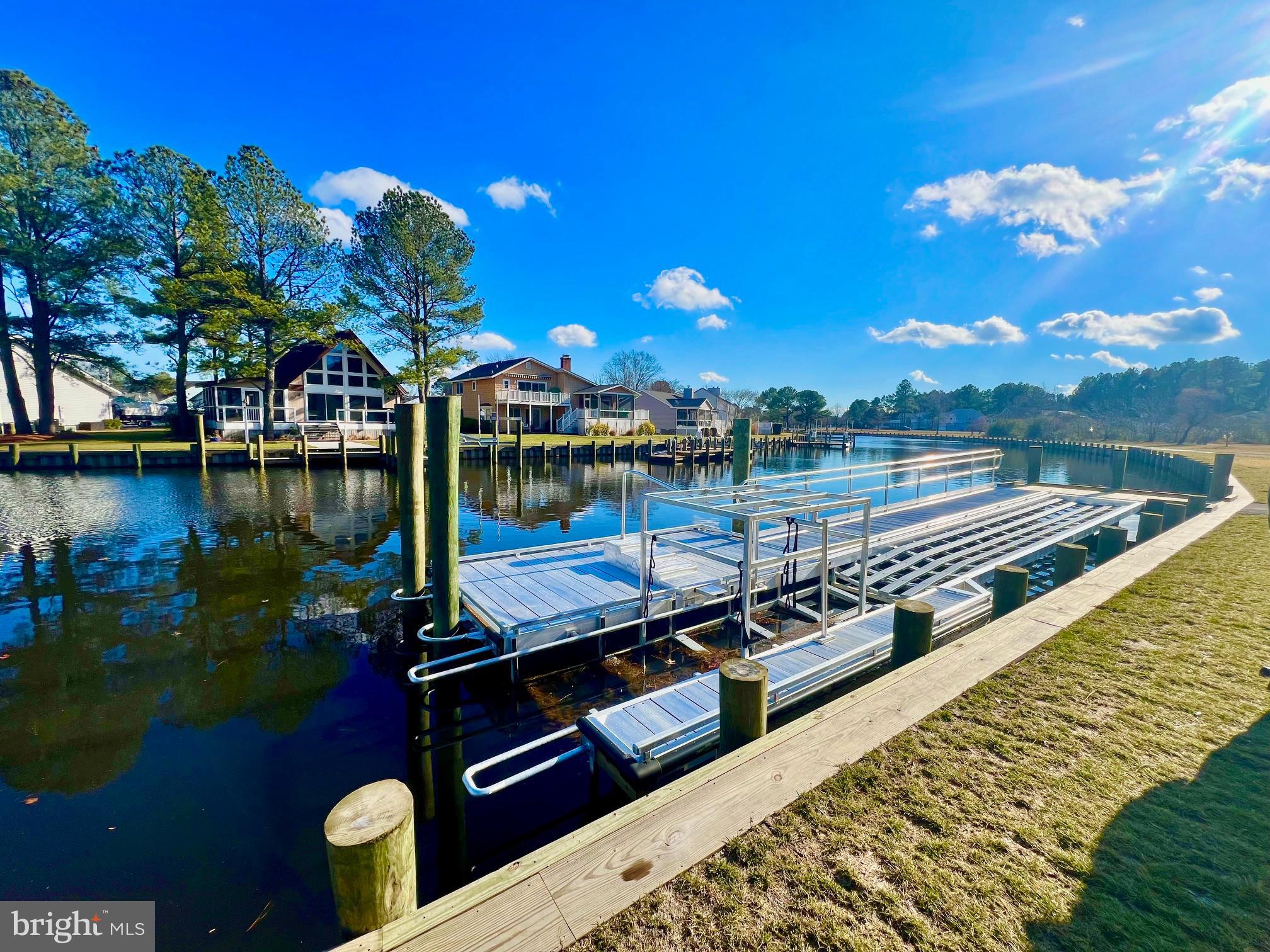 60 Nottingham Lane Berlin, MD 21811 - Photo 28 of 38 a view of a lake with couches chairs