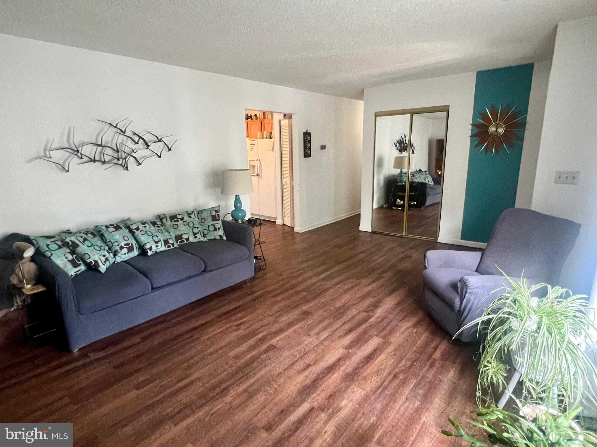 60 Nottingham Lane Berlin, MD 21811 - Photo 31 of 38 a living room with furniture and wooden floor