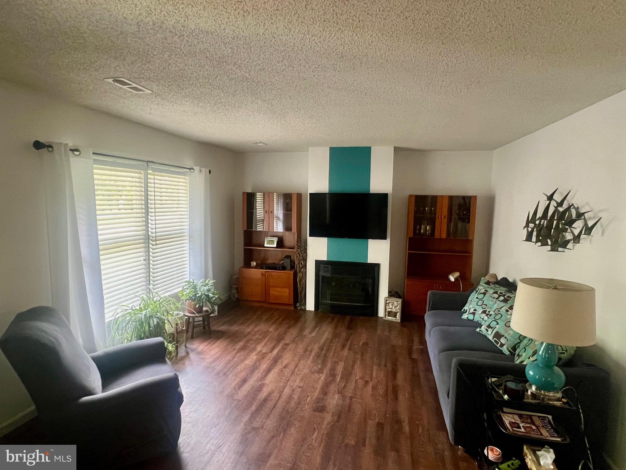 60 Nottingham Lane Berlin, MD 21811 - Photo 4 of 38 a living room with furniture and a wooden floor