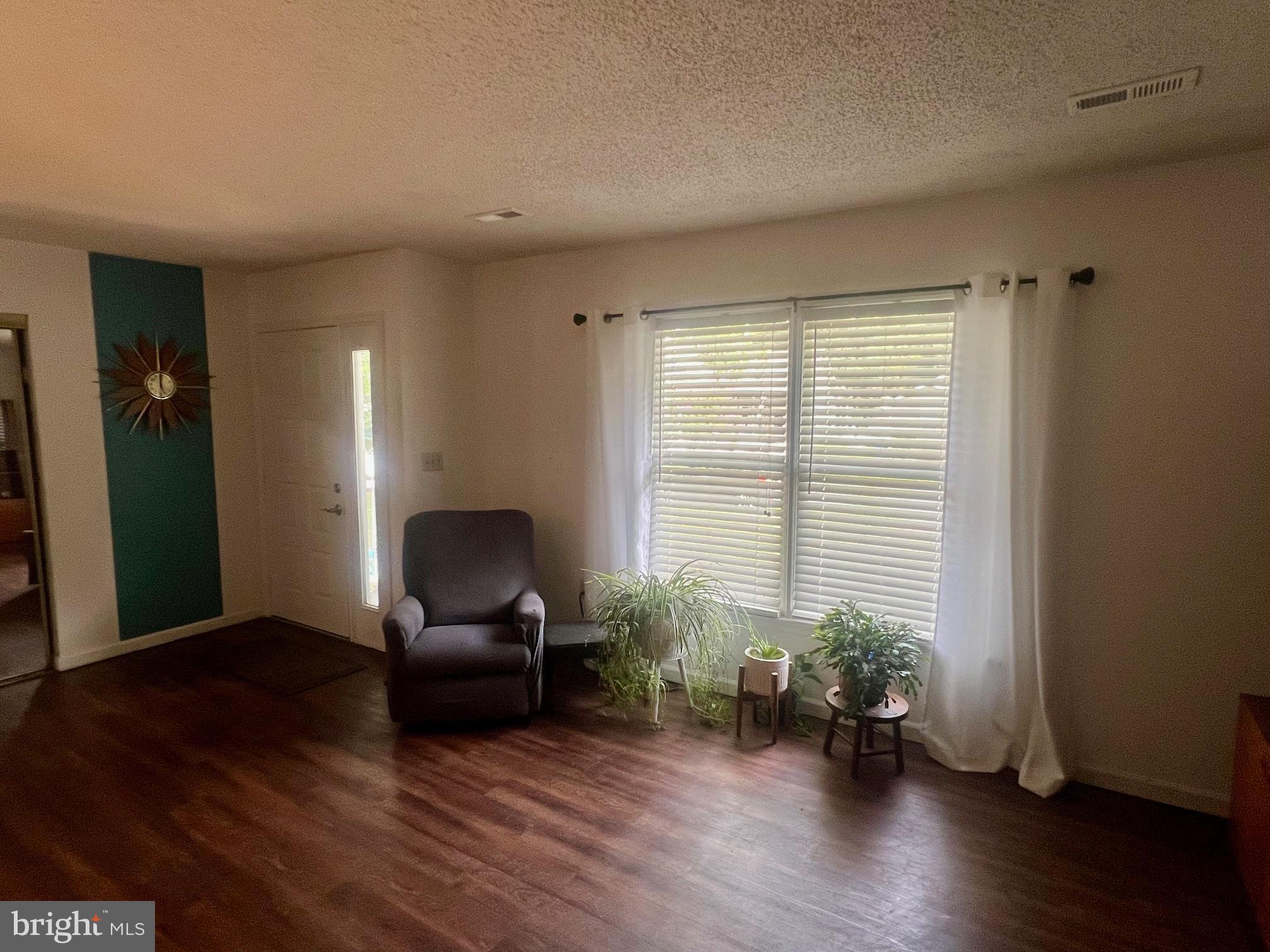 60 Nottingham Lane Berlin, MD 21811 - Photo 5 of 38 a workspace with furniture and a window