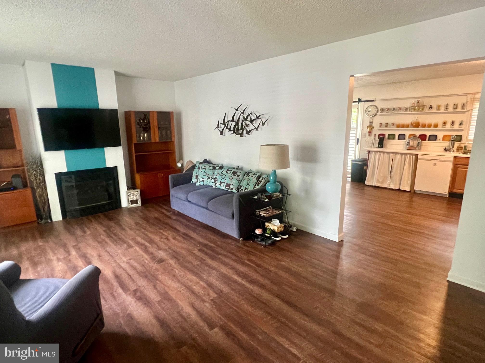 60 Nottingham Lane Berlin, MD 21811 - Photo 6 of 38 a living room with furniture and a flat screen tv