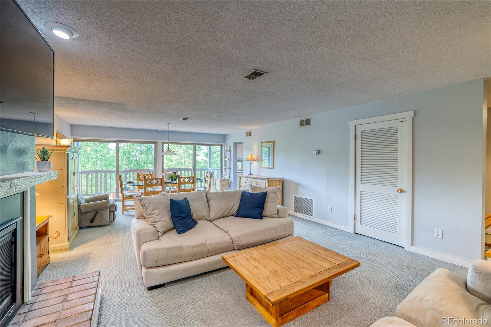 2510 Ryan Gulch Road, Unit 2512 Silverthorne, CO 80498 - Photo 16 of 41 a living room with furniture and a rug