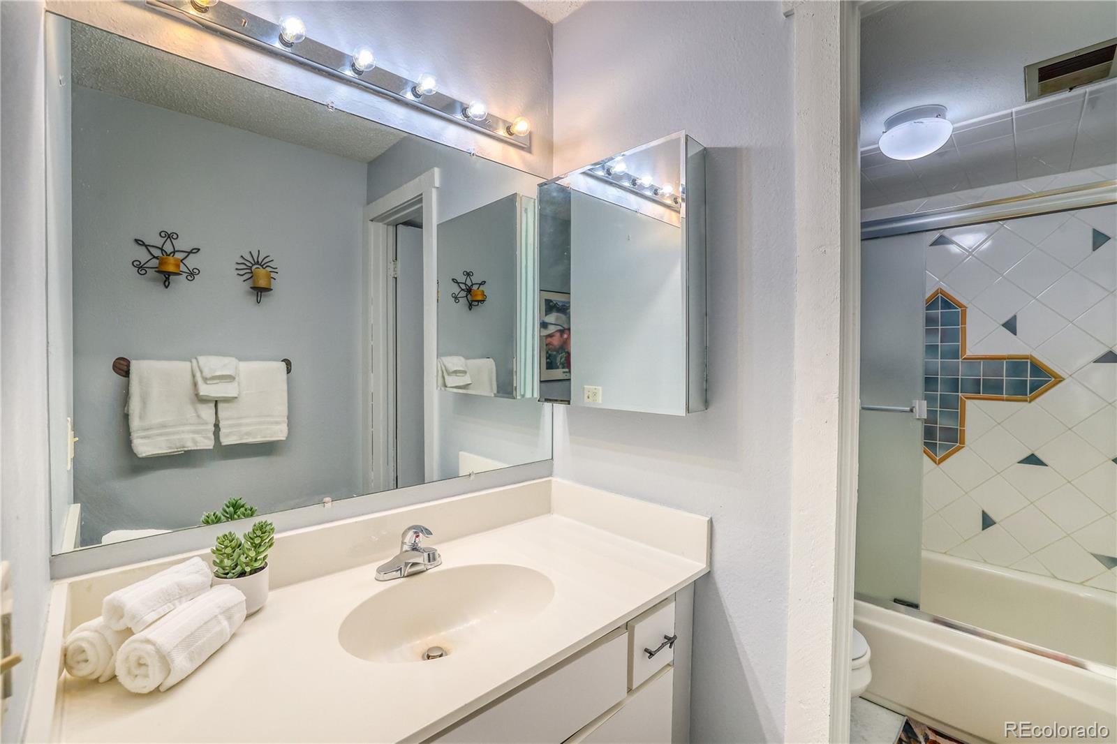 2510 Ryan Gulch Road, Unit 2512 Silverthorne, CO 80498 - Photo 22 of 41 a bathroom with a sink a toilet and shower