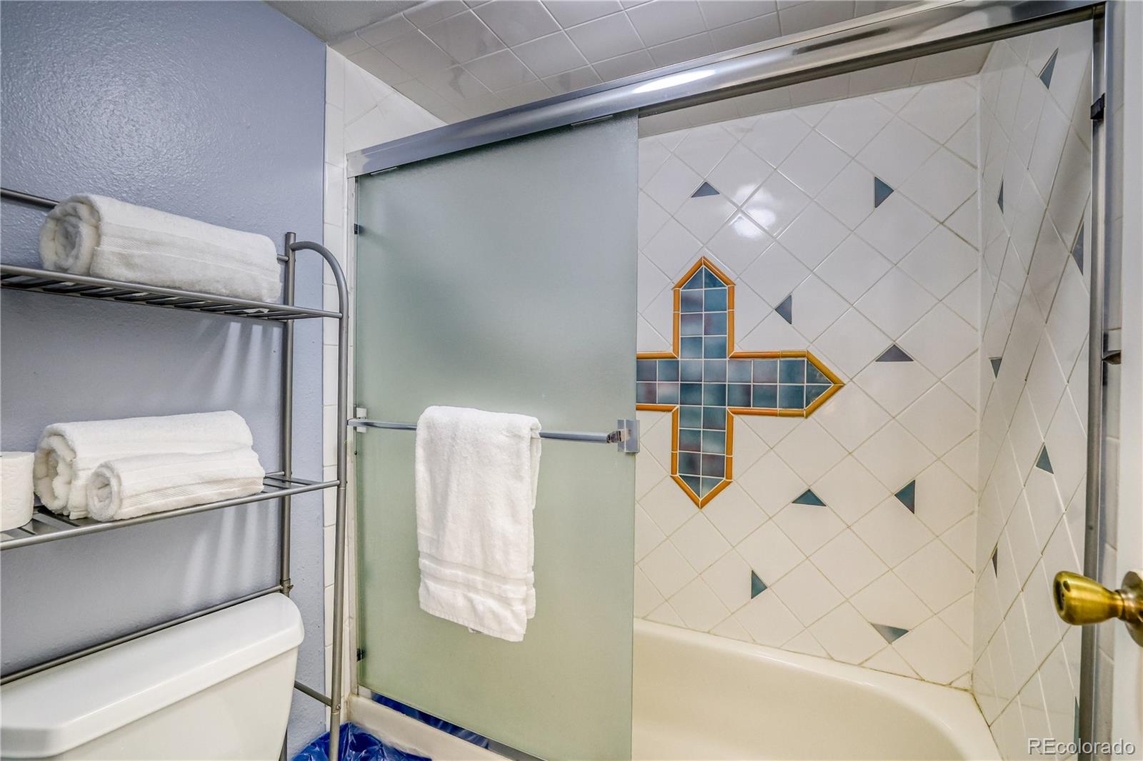 2510 Ryan Gulch Road, Unit 2512 Silverthorne, CO 80498 - Photo 24 of 41 a bathroom with a bathtub and shower