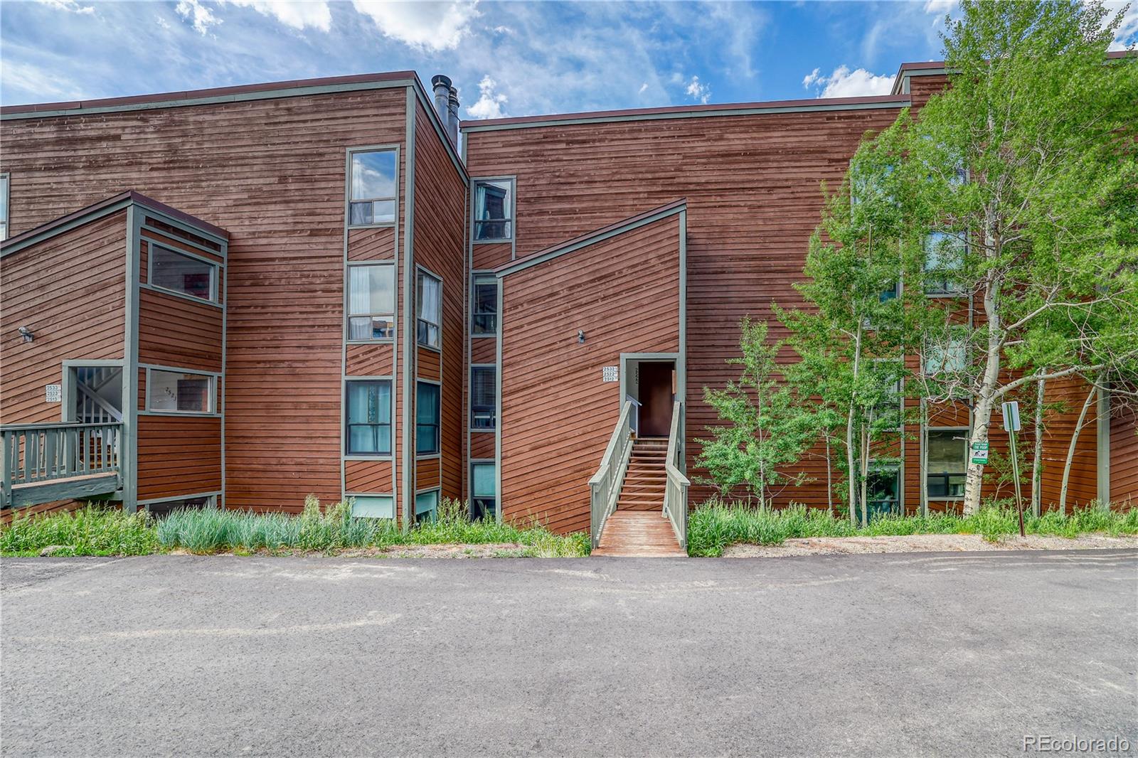 2510 Ryan Gulch Road, Unit 2512 Silverthorne, CO 80498 - Photo 32 of 41 a brick building with a street