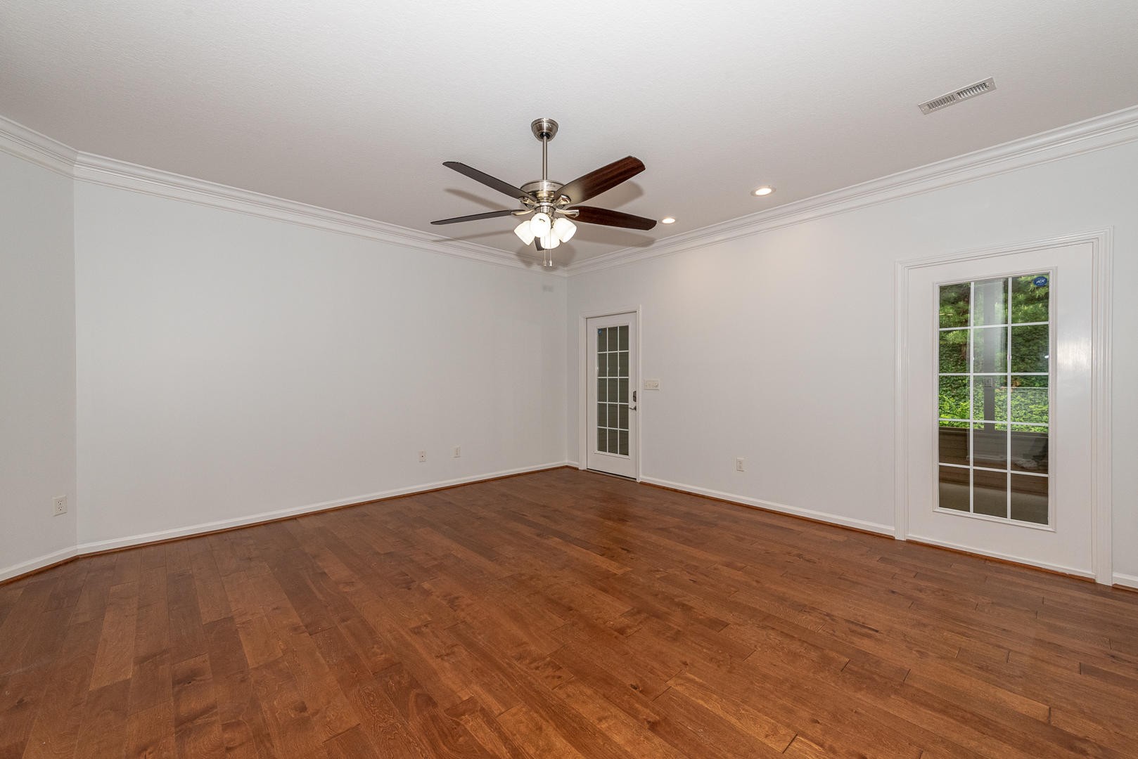 116 Devanshire Court Oak Ridge, TN 37830 - Photo 11 of 30 wooden floor in an empty room with a window